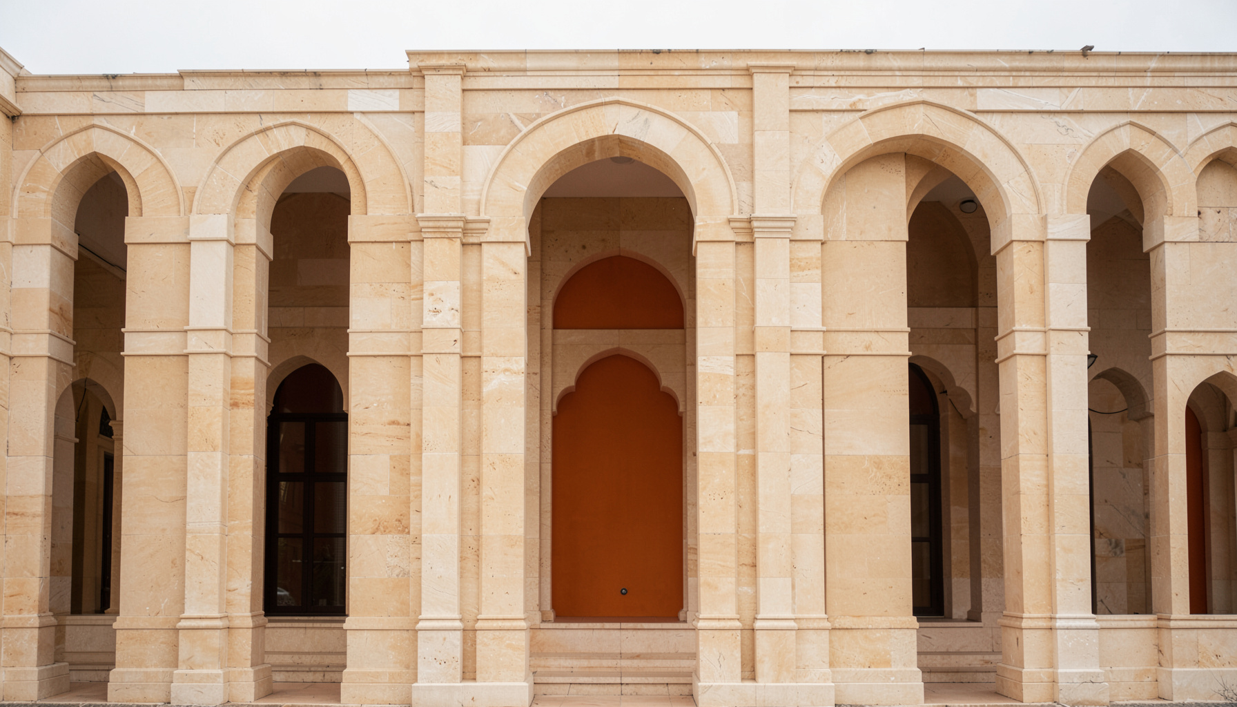 Symmetrical architectural facade with repeating arches and warm beige stone, soft overcast light, calm and balanced mood